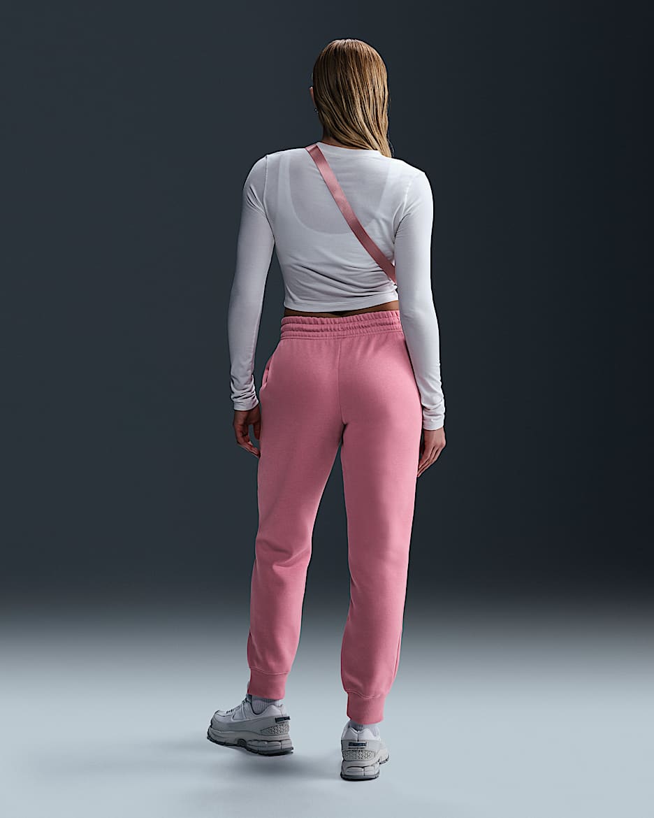 Nike pink tracksuit bottoms online